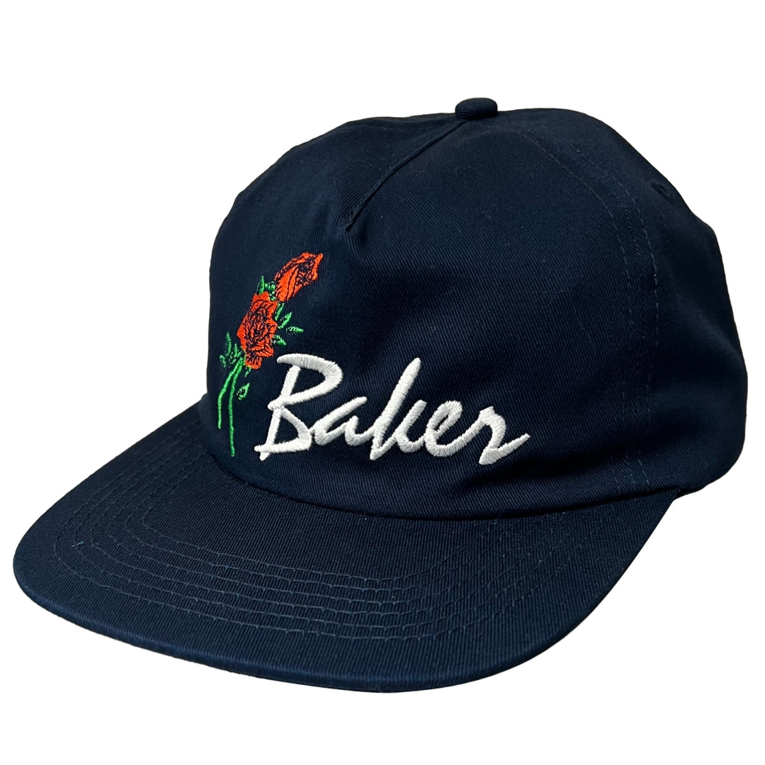 Navy blue cap with embroidered roses and 'Baker' text on a white background