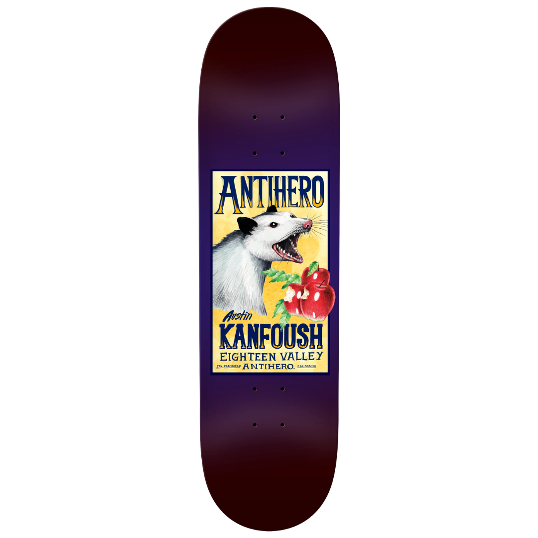 A skateboard deck shown vertically against a plain white background. The deck has a dark purple-to-black gradient border with a large vintage-style graphic in the center featuring the text 'ANTHERO' and 'KANOFOUSH' and an illustration of a white dog with red peppers.