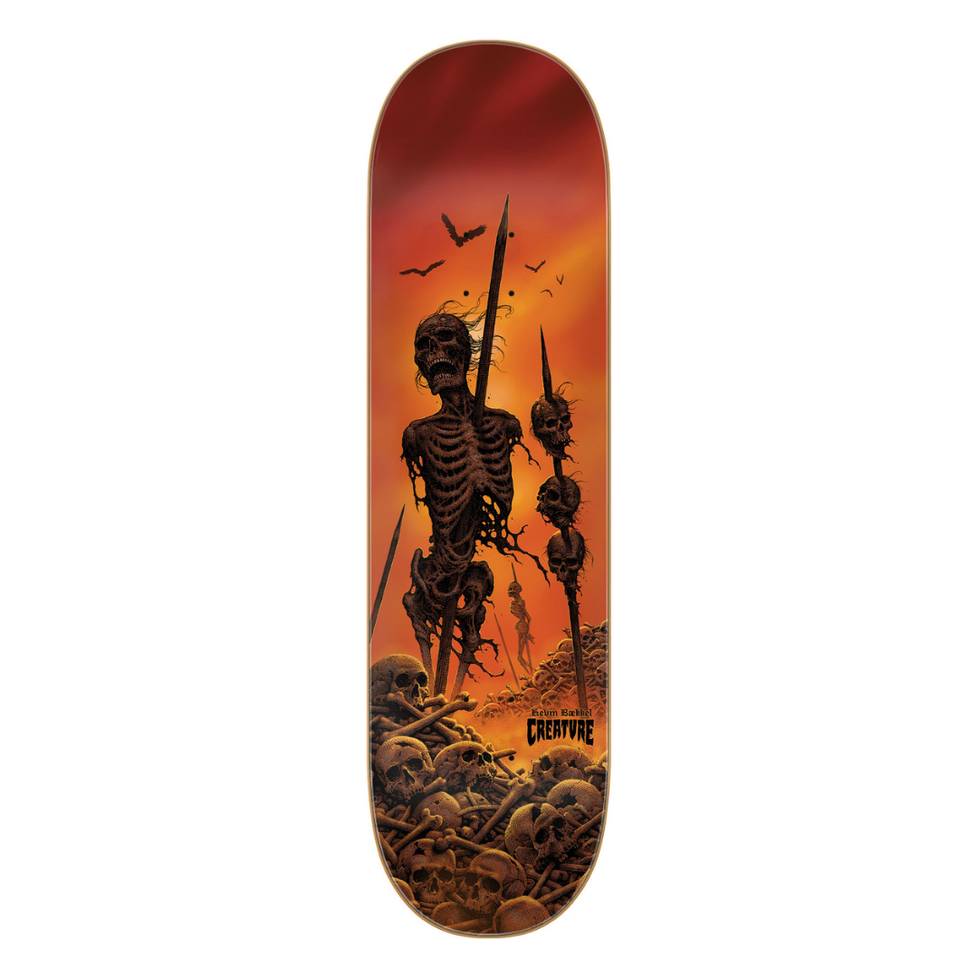 A skateboard deck featuring a dark gothic illustration of a skeleton warrior holding a spear, surrounded by skulls and crows, set against a fiery orange and red sunset background. The brand name 'CREATIVE' is printed in black near the bottom right.