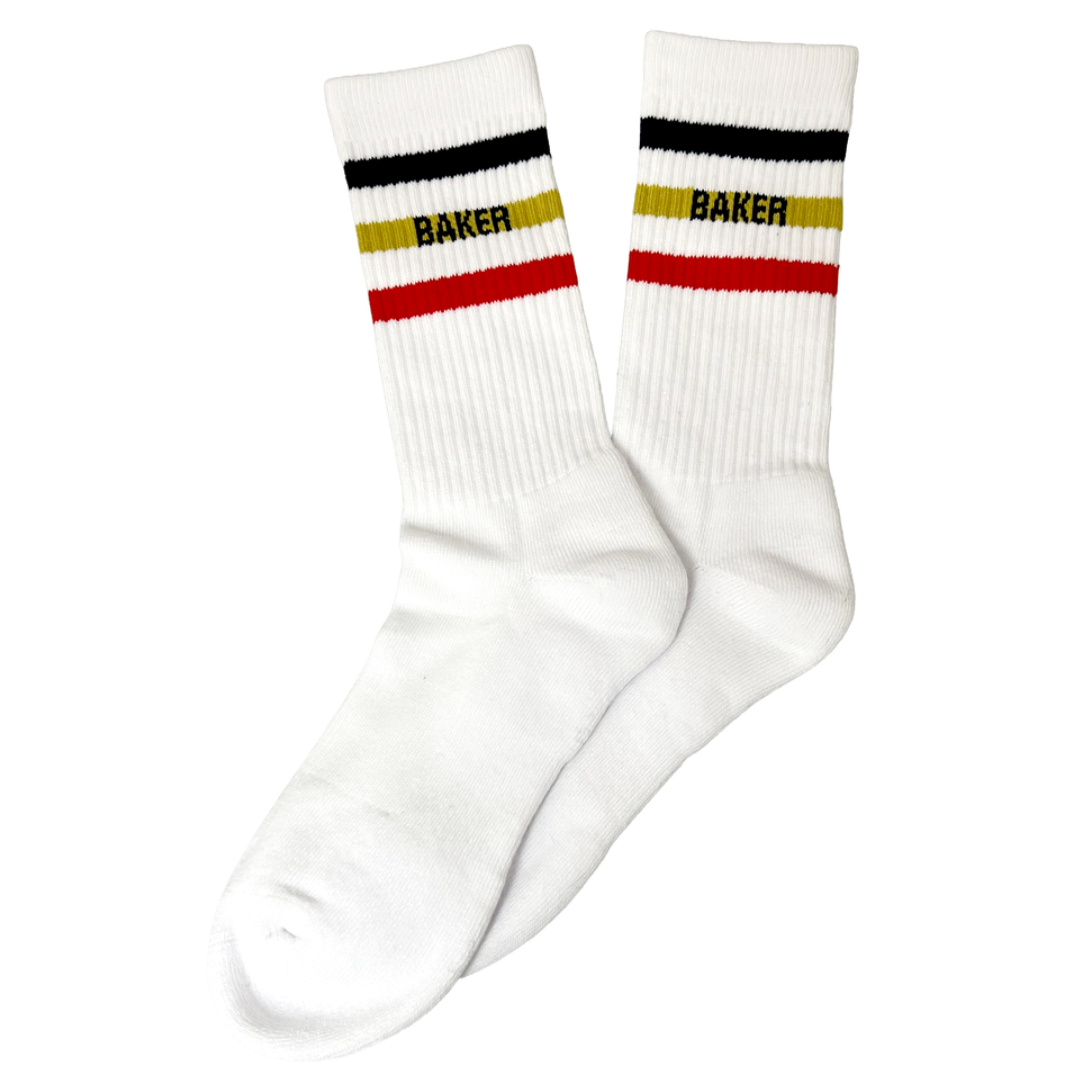 A pair of white crew socks with horizontal stripes in black, yellow, and red at the ribbed cuff, featuring the word 'BAKER' printed in black across the yellow stripe.