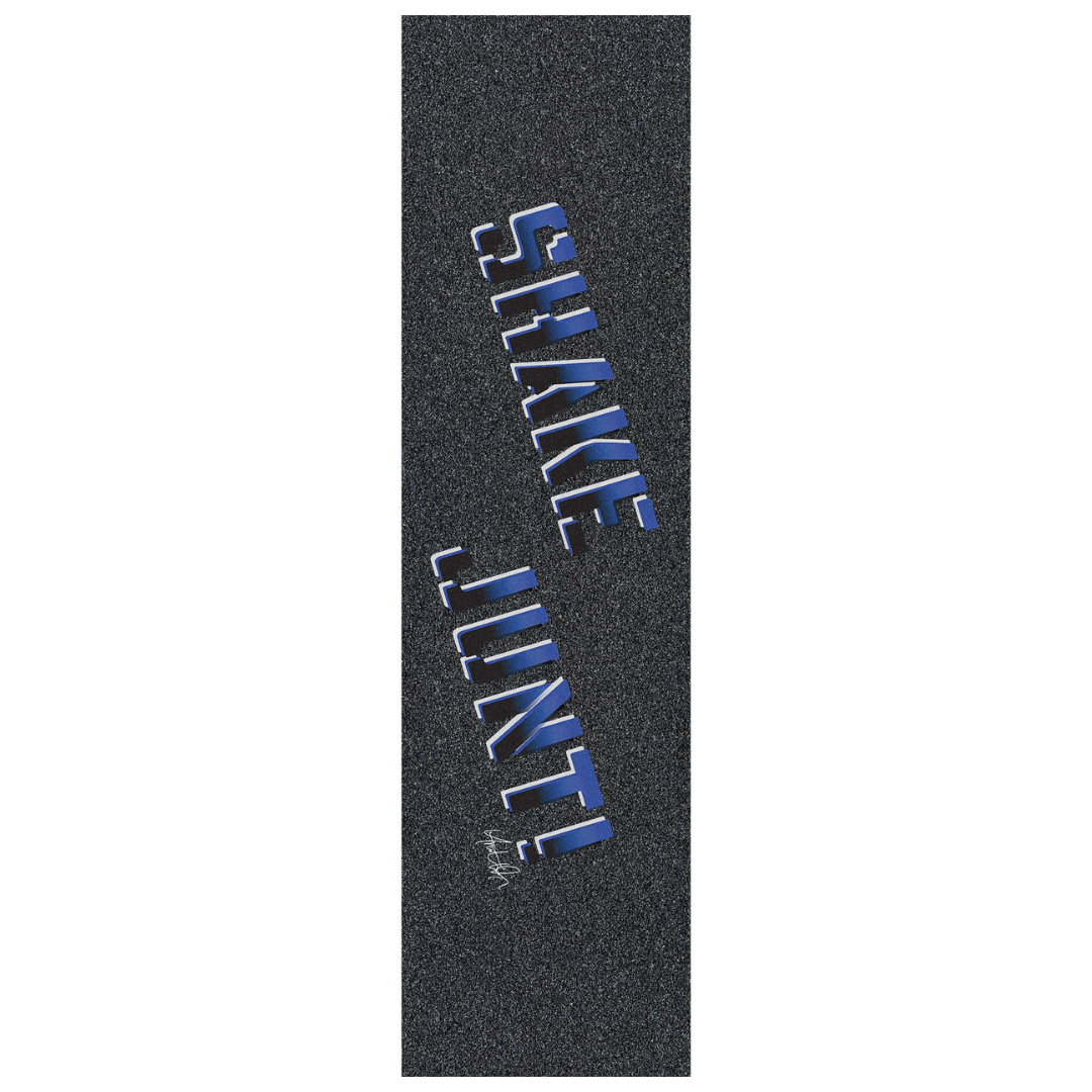 A vertical close-up of skateboard grip tape with a dark gray textured surface and large blue and white 'SHAKE LINT' lettering printed diagonally.