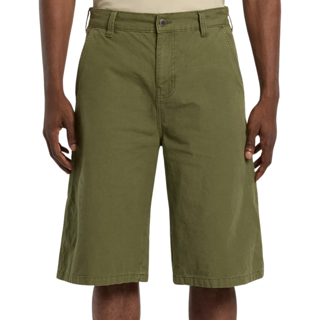 Green shorts worn by a person on a white background