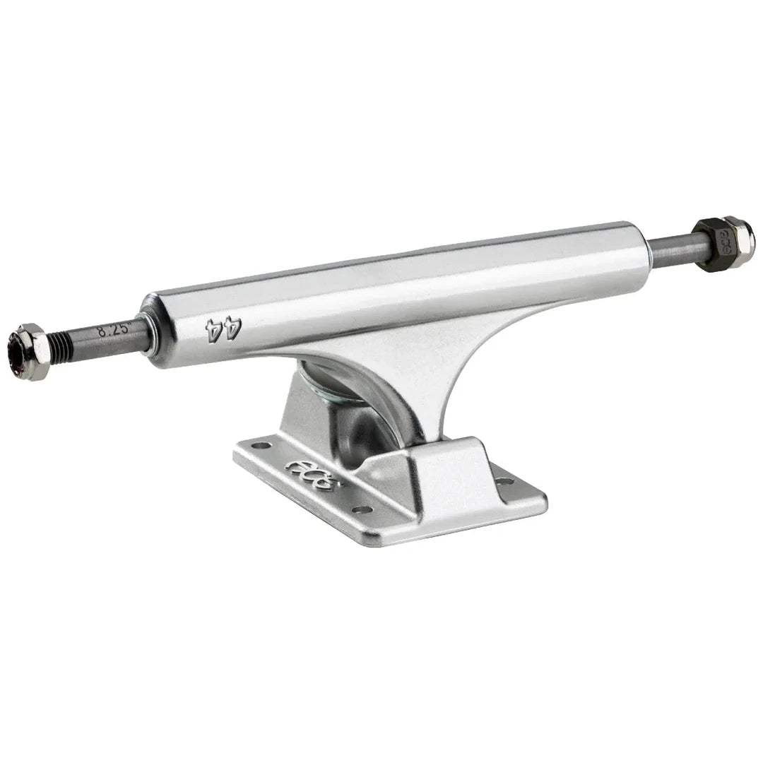 A chrome skateboard truck with a polished silver metal finish, featuring a visible '77' stamp on the side and a black bushing at each end, set against a plain white background.