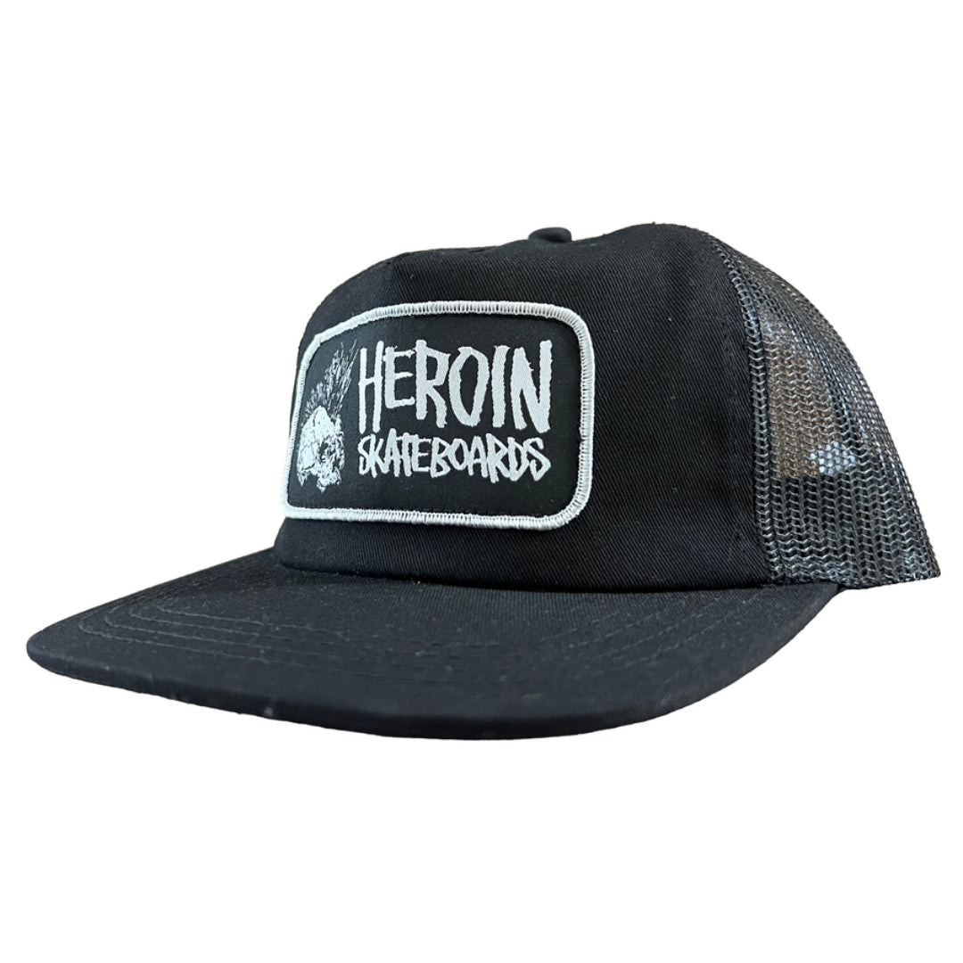 Black trucker cap with 'Heroin Skateboards' logo on a white background