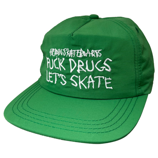 Green cap with white text on a white background