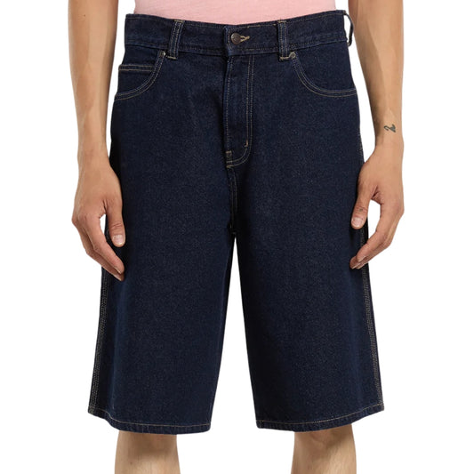 Dark blue denim shorts worn by a person on a white background