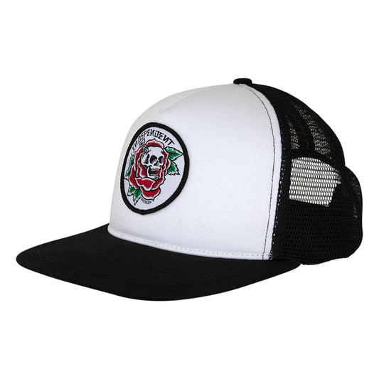 White and black trucker hat with a skull and rose patch on a white background