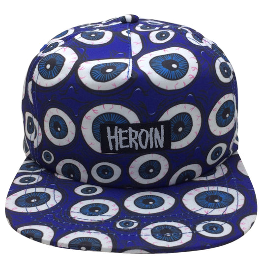 Blue cap with white and blue circular patterns and 'HEROIN' text on a white background