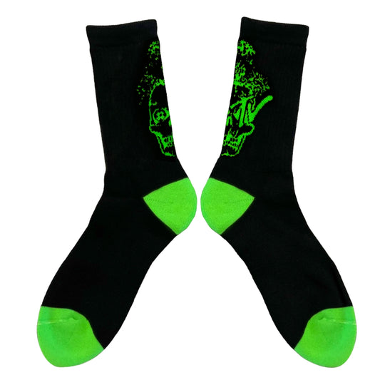 Black socks with green patterns and green toes and cuffs on a white background