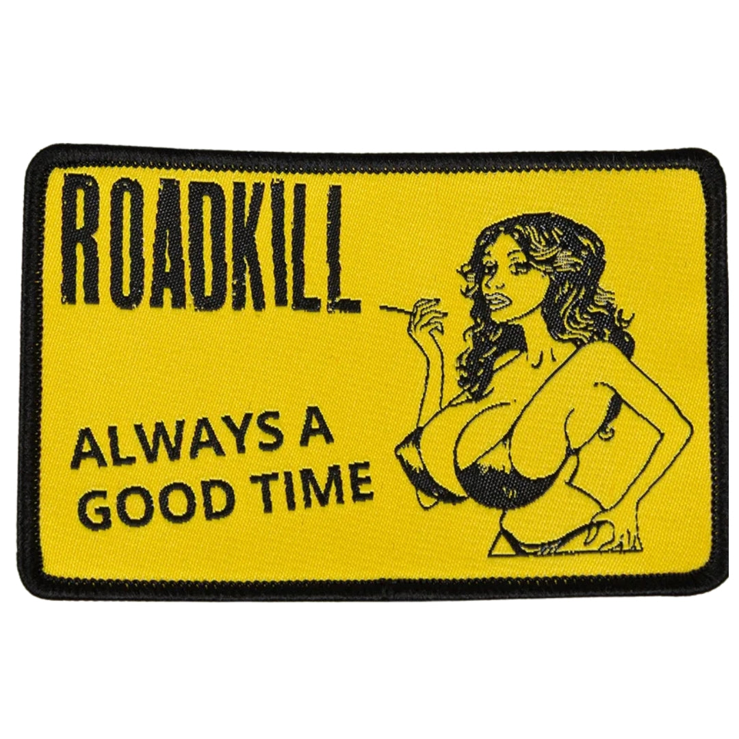Patch with 'Roadkill Always a Good Time' text and a graphic of a woman on a yellow background.