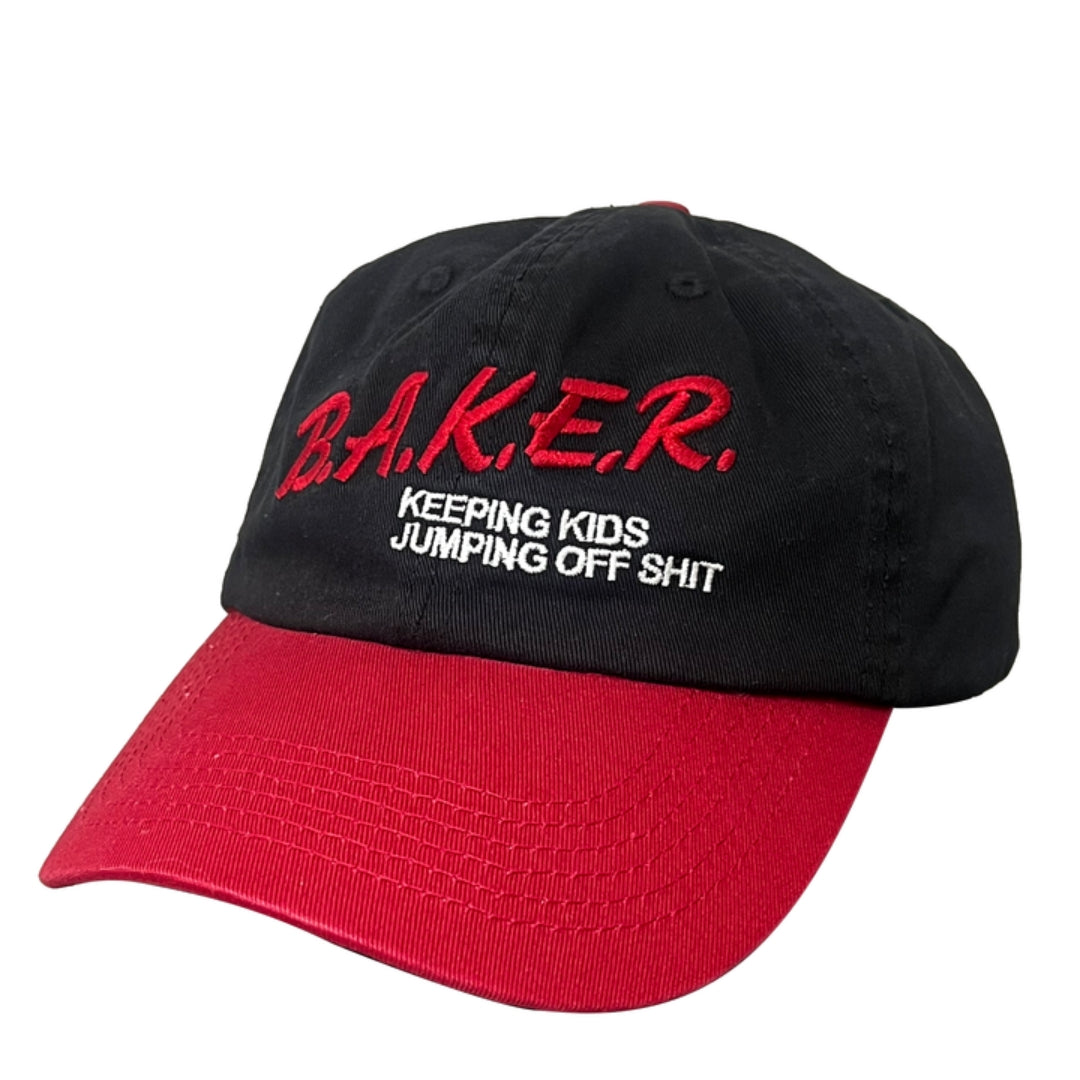 Black cap with red brim and text on a white background