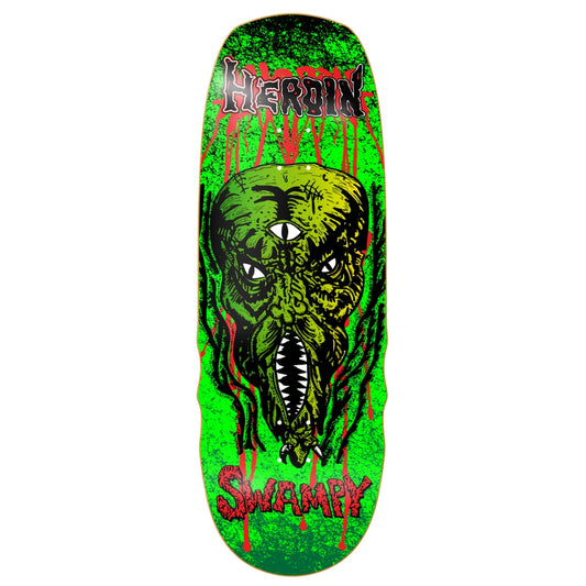 Skateboard deck with a green and black design featuring a face and the word 'Heroin' on a white background.