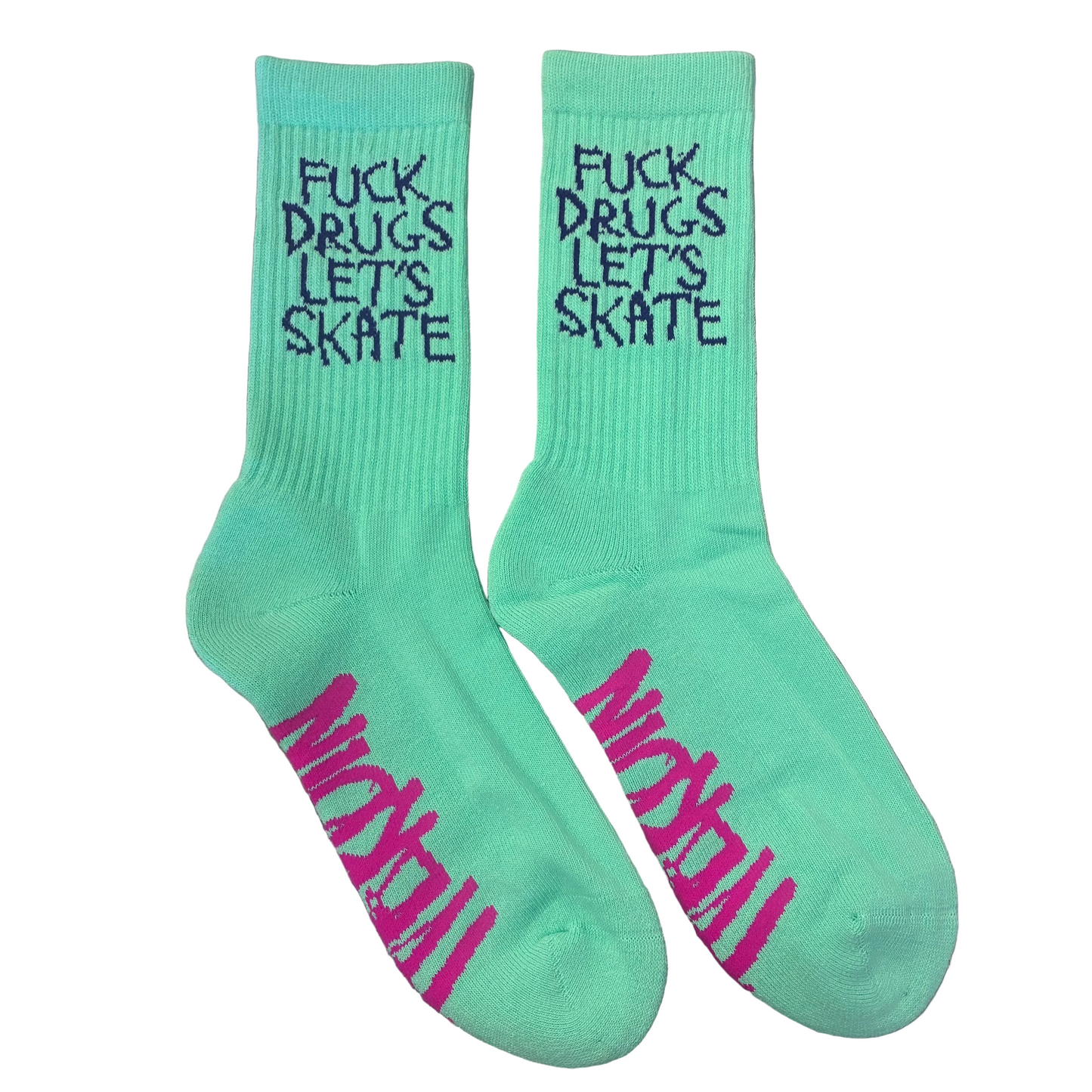 Pair of green socks with text on a reflective surface